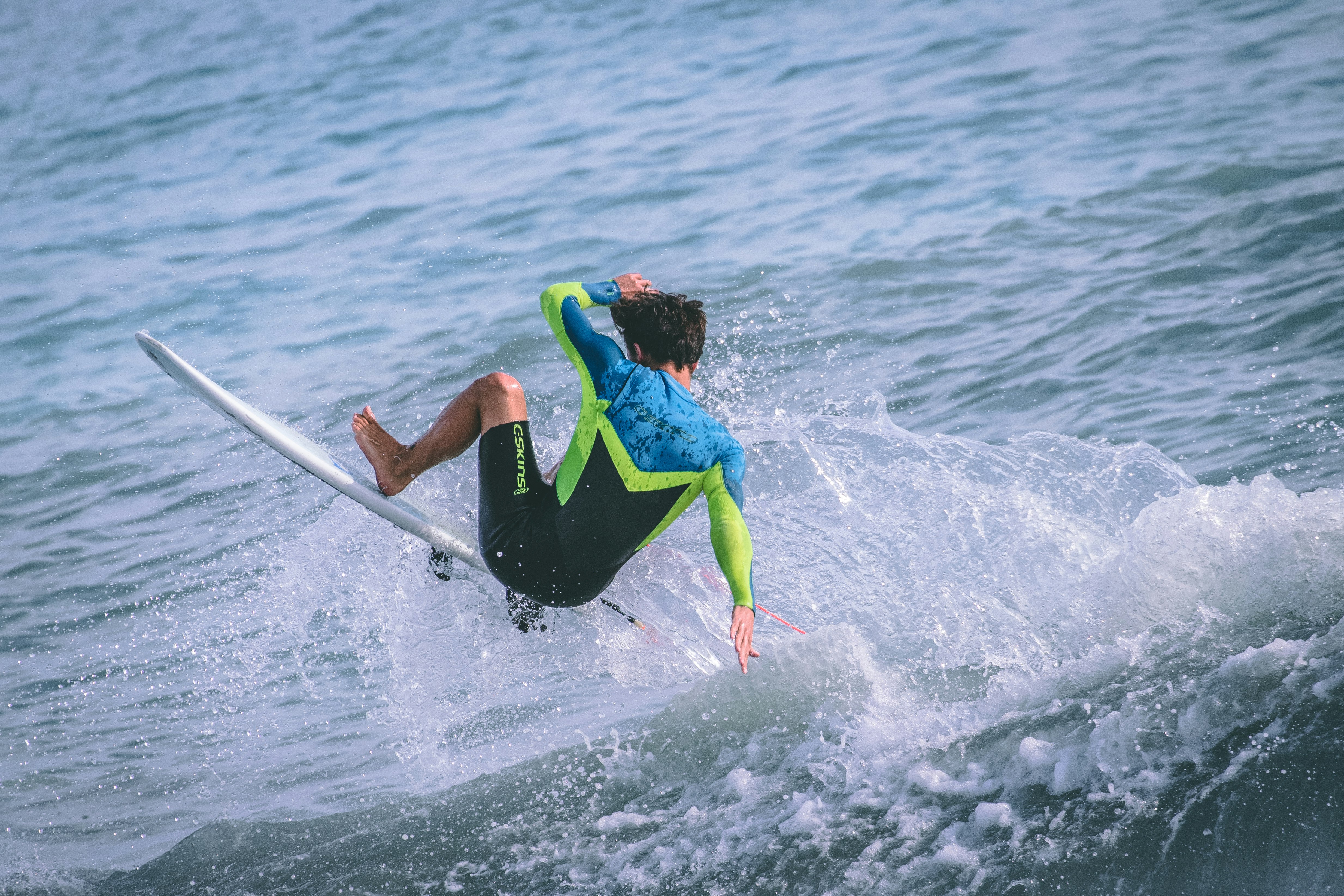 man surfing on sea waves